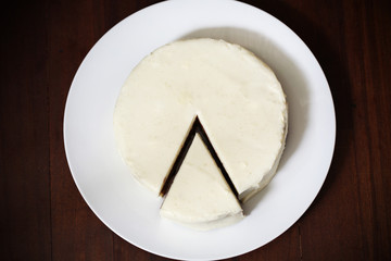 Cream cheese pie or cake with cut piece, dessert