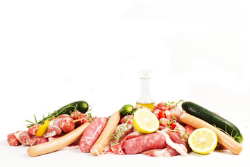 raw meat with rosemary, lemon on a white background