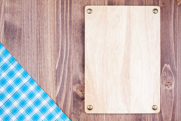 Wooden board, tablecloth on wood background