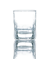 Empty vodka or whisky glass beaker isolated on white background
