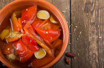 Pickled peppers in a bowl, rustic