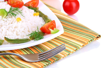 Delicious risotto with vegetables isolated on white