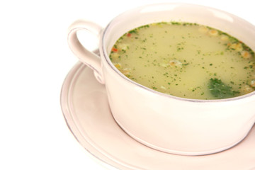 Nourishing soup with vegetables in pan isolated on white