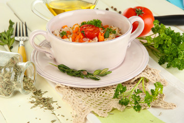 Delicious rice with vegetables and herbs in pot