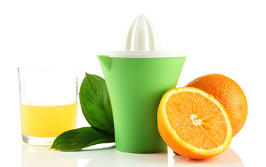 Citrus press, glass of juice and ripe oranges, isolated on