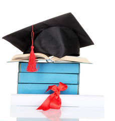 Grad hat with diploma and books isolated on white