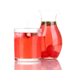 Cherry drink in pitcher and glass isolated on white.