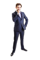 Smiling businessman with hand on hip