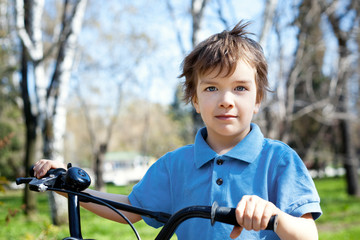 Portert boy with bicycle, outdoor