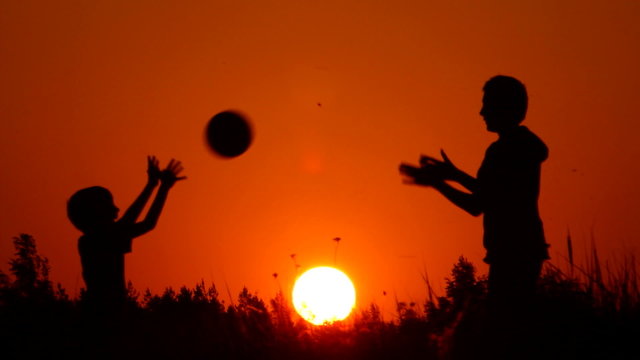 silhouettes of volleyball players