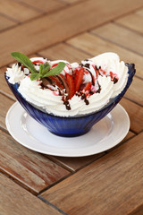 Vanilla ice cream covered with chocolate syrup