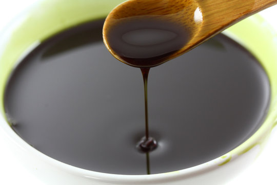 Pumpkin Seed Oil Dripping in a bowl