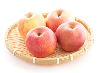 Apple Fuji in bamboo basket