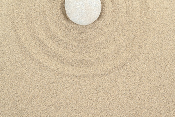 Fototapeta na wymiar zen stone in sand with circles