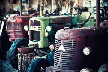 Old abandoned farm tractors. obsolescence and past concept