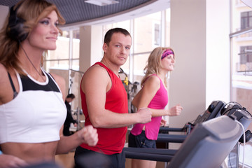 Group of people  running on treadmill in gym