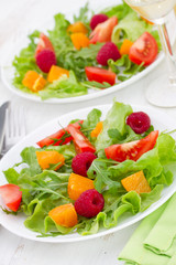 Fototapeta na wymiar fresh salad with raspberries