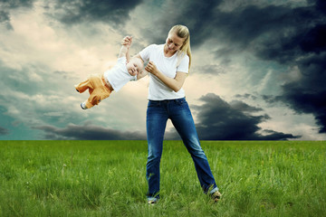 Mother and son funning outdoors