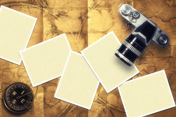 Blank card with old compass on old map background.
