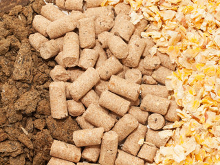 sunflower meal, maize and bran background. Food for horses and f