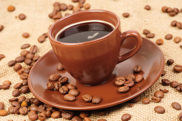 Composition with brown cup of coffee