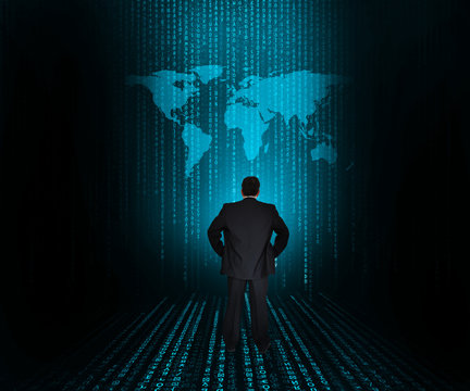 Businessman looking at large world map