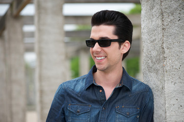 Attractive young man outdoors with sunglasses