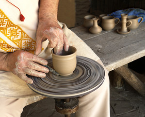 hands of a potter at work