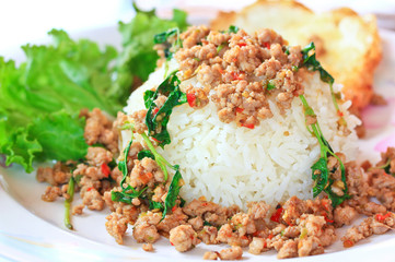Thai spicy food; Fried pork with sweet basil and fried egg