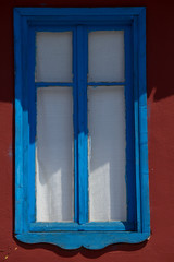 Blue window on red wall