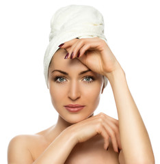 beautiful woman with a towel on his head on a white background