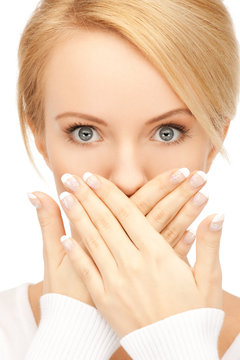 amazed woman with hand over mouth
