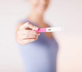 woman with pregnancy test