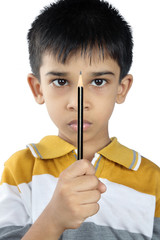 Indian little boy holding the pencil