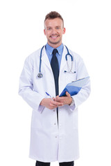 smiling doctor holding a pen and a clipboard
