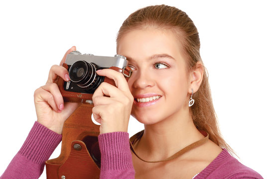 Beautiful young woman with camera