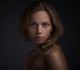 portrait of young woman on dark backround - 52385486