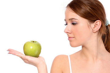 A portrait of beautiful young woman with a green apple