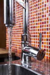 kitchen faucet flowing