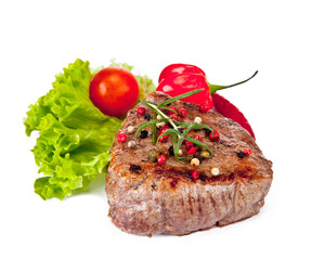 Grilled steaks isolated on white background