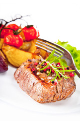 Grilled steak and potato isolated on white background