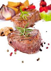 Grilled steak and potato isolated on white background