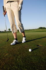 Golf serie, woman playing golf on a course