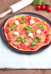 Pizza with mozarella and basil