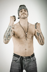 man with brass knuckles in grunge background