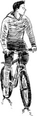 Fototapeta na wymiar young man riding a bicycle
