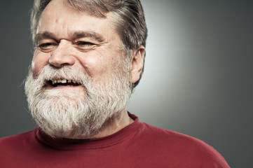 Obraz premium Mature Caucasian Man Laughing And Looking Away