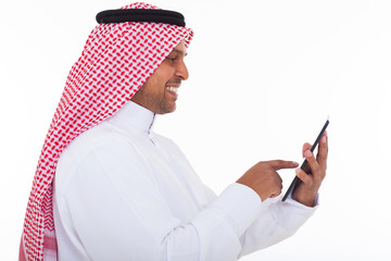 side view of arabian man using tablet computer