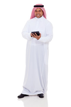 middle eastern man using tablet computer