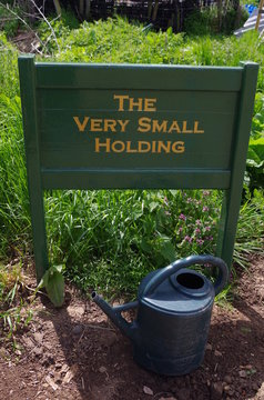 The Very Small Holding Sign